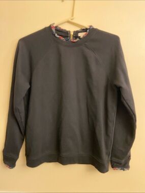 J. Crew black sweatshirt with tartan plaid collar.
